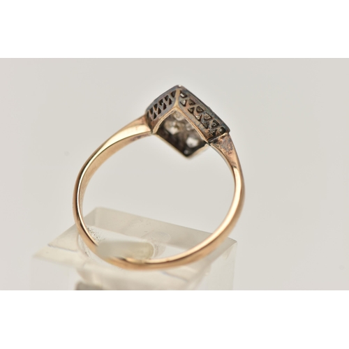 2 - A YELLOW METAL DIAMOND RING, rhombus shape set with eleven old cut diamonds and one round brilliant ... 