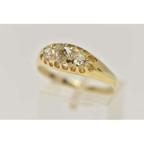 21 - A YELLOW METAL THREE STONE DIAMOND RING, set with three old cut diamonds, estimated total diamond we... 