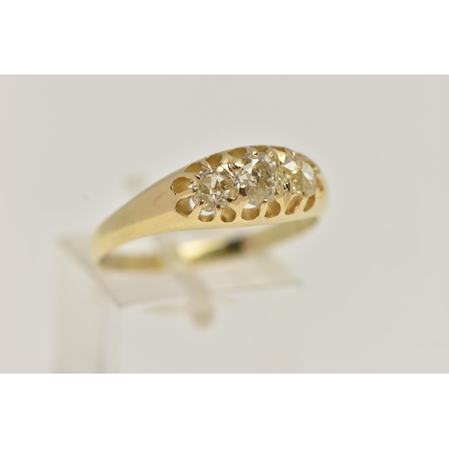 21 - A YELLOW METAL THREE STONE DIAMOND RING, set with three old cut diamonds, estimated total diamond we... 