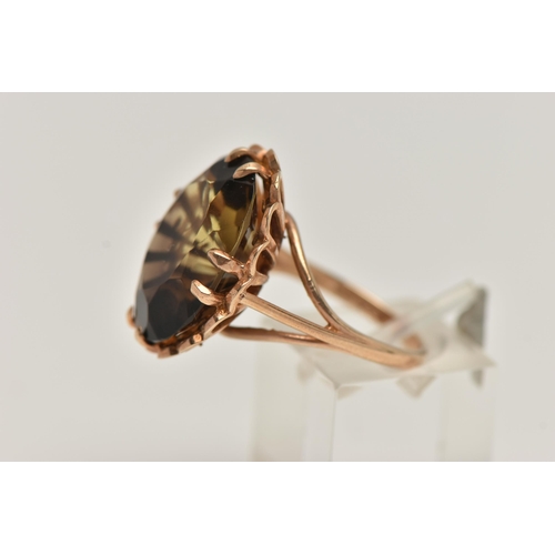 3 - A LARGE 9CT GOLD SMOKY QUARTZ DRESS RING, oval cut smoky quartz, double claw set within an open work... 