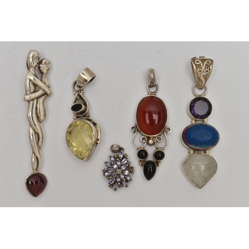 35 - FIVE WHITE METAL STATEMENT PENDANTS, various designs, set with stones to include carnelian, moonston... 