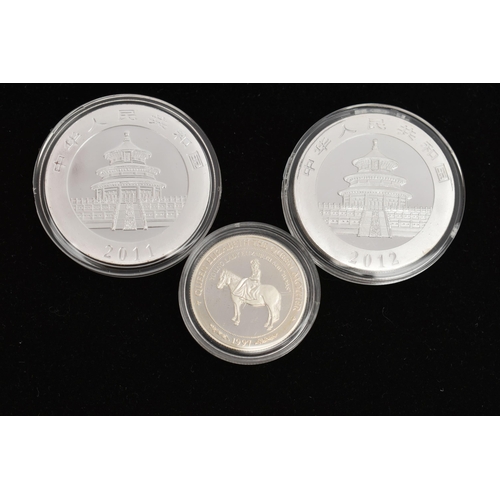 44 - THREE SILVER COINS, to include two 1oz Ag .999 Chinese Panda coins, both in protective capsules, tog... 