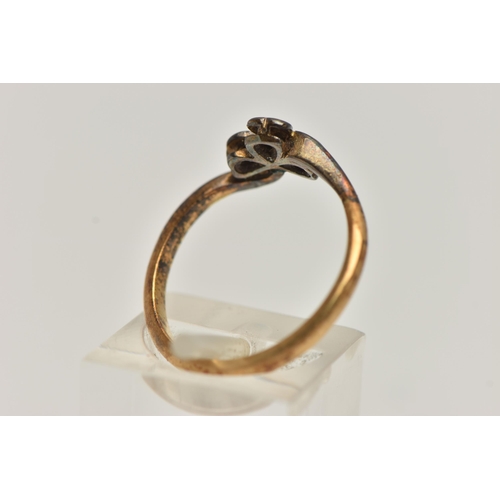 49 - A TREFOIL DIAMOND RING, three single cut diamonds, set in a clover design mount leading on to a yell... 