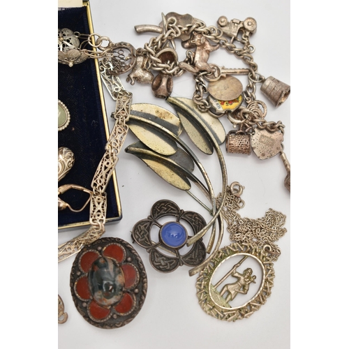 51 - AN ASSORTMENT OF WHITE METAL JEWELLERY, to include two Scottish brooches, a charm bracelet fitted wi... 