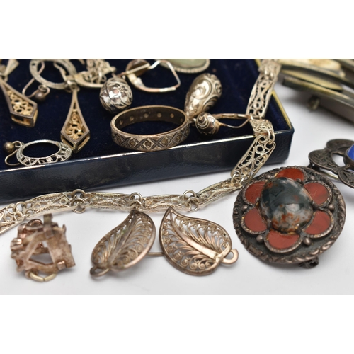 51 - AN ASSORTMENT OF WHITE METAL JEWELLERY, to include two Scottish brooches, a charm bracelet fitted wi... 