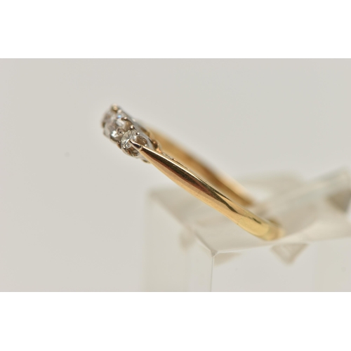 53 - A THREE STONE DIAMOND RING, three old cut diamonds, prong set in white metal, leading on to a yellow... 