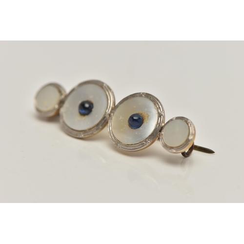 55 - A CONVERSION BROOCH, four mother of pearl white and yellow metal dress studs fitted together, fitted... 