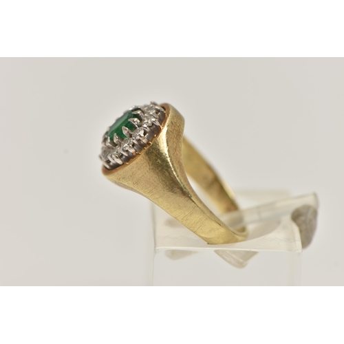 58 - A 14CT GOLD GEM SET RING, a signet style cluster ring, oval cut emerald, prong set with a surround o... 