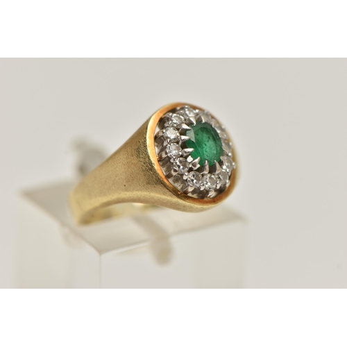 58 - A 14CT GOLD GEM SET RING, a signet style cluster ring, oval cut emerald, prong set with a surround o... 