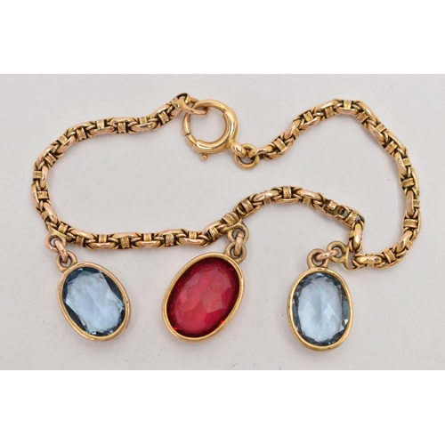 60 - A YELLOW METAL GEM SET BRACELET, two oval cut synthetic blue spinel's and an oval cut synthetic ruby... 