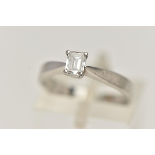 66 - A PLATINUM SINGLE STONE DIAMOND RING, emerald cut diamond prong set in platinum, leading on to a pin... 