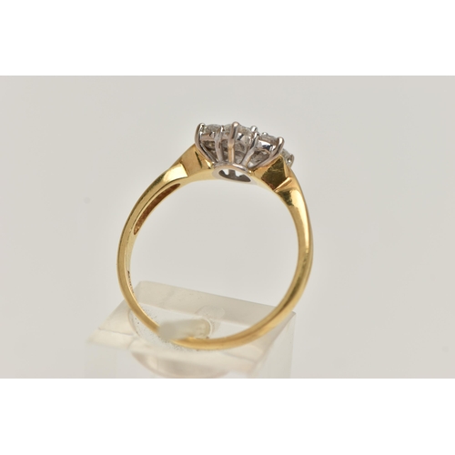 67 - A 18CT GOLD DIAMOND CLUSTER RING, seven round brilliant cut diamonds, prong set in white gold, appro... 