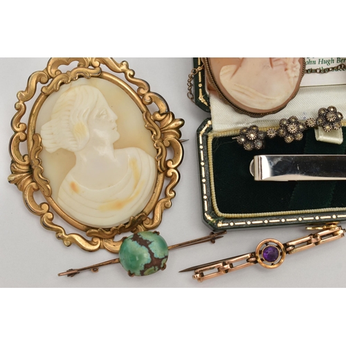 72 - AN ASSORTMENT OF EARLY AND MID CENTURY BROOCHES, to include a yellow metal target brooch, set with a... 