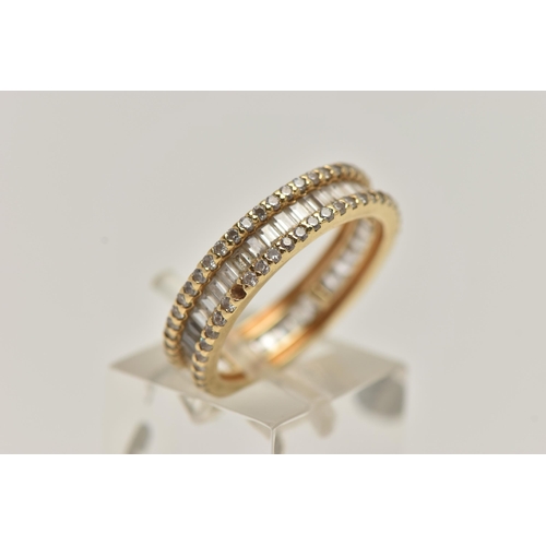 8 - A YELLOW METAL DIAMOND BAND RING, set with a central row of baguette cut diamonds, between two rows ... 