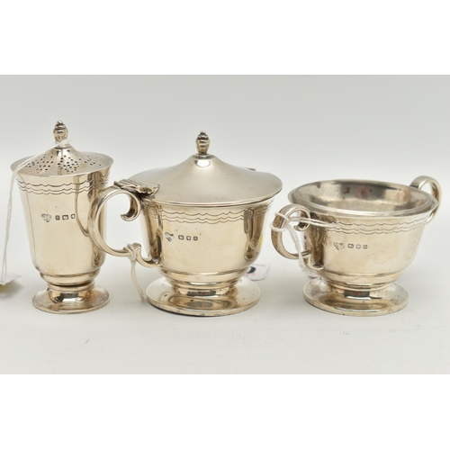 100 - A GEORGE VI SILVER THREE PIECE CRUET SET, of circular form with engraved band of three wavy lines, o... 