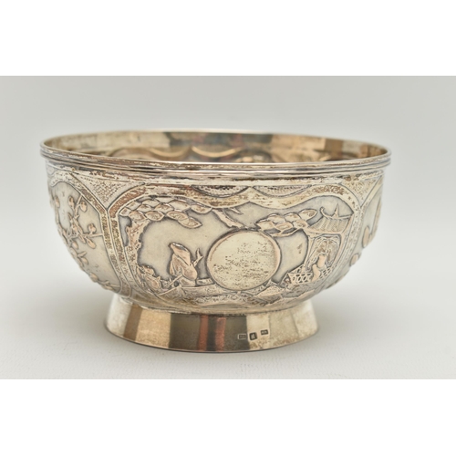 101 - A LATE 19TH / EARLY 20TH CENTURY CHINESE WHITE METAL BOWL OF CIRCULAR FORM, repoussé decorated with ... 