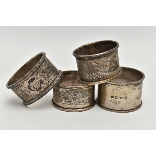 90 - FOUR SILVER NAPKIN RINGS, each with a different design, each hallmarked with Bristish hallmarks, app... 