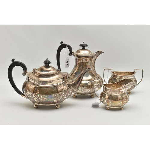 97 - A GEORGE V SILVER FOUR PIECE TEA SERVICE OF FLUTED OVAL FORM, comprising tea pot, hot water jug, mil... 