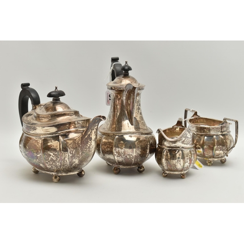 97 - A GEORGE V SILVER FOUR PIECE TEA SERVICE OF FLUTED OVAL FORM, comprising tea pot, hot water jug, mil... 