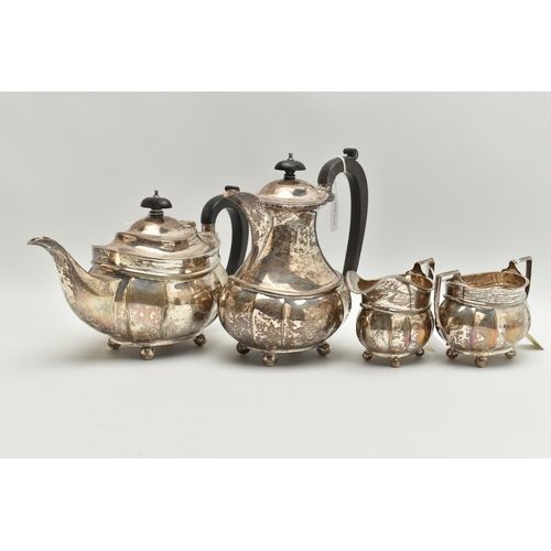 97 - A GEORGE V SILVER FOUR PIECE TEA SERVICE OF FLUTED OVAL FORM, comprising tea pot, hot water jug, mil... 