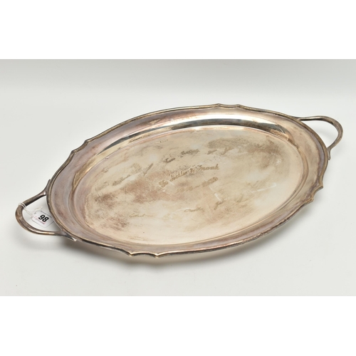 98 - A GEORGE VI SILVER OVAL TWIN HANDLED TRAY WITH WAVY EDGE, the front inscribed with presentation insc... 