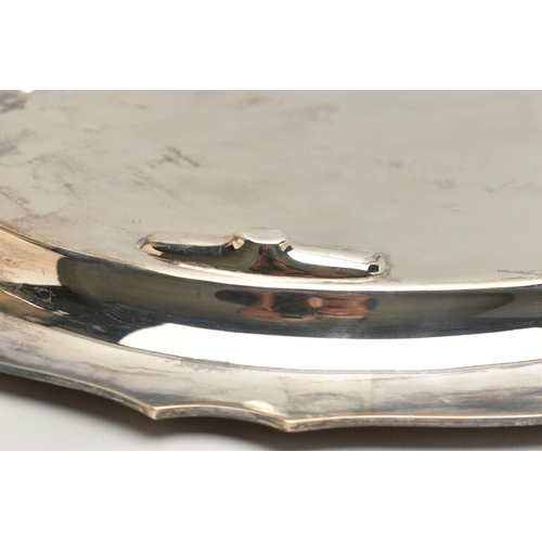 98 - A GEORGE VI SILVER OVAL TWIN HANDLED TRAY WITH WAVY EDGE, the front inscribed with presentation insc... 