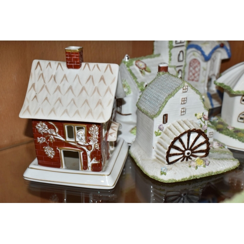 336 - EIGHT COALPORT BONE CHINA COTTAGES / BUILDINGS PASTILLE BURNERS, comprising 'Village Church', 'The T... 