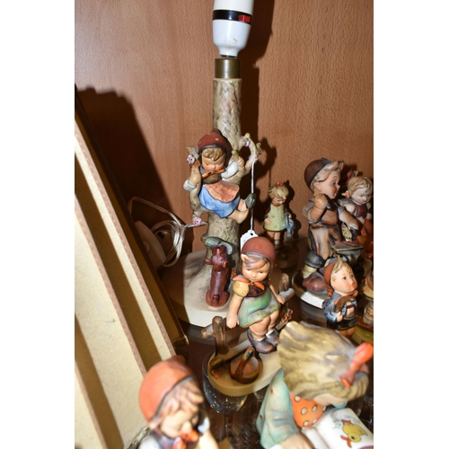 347 - A COLLECTION OF TWENTY TWO GOEBEL HUMMEL FIGURES, A HUMMEL LAMP WITH SHADE AND A HUMMEL REUGE MUSICA... 