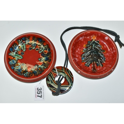 357 - THREE PIECES OF ANITA HARRIS POTTERY, comprising a pair of hand painted pin dishes with Christmas th... 