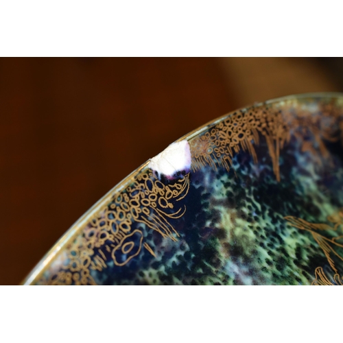 371 - DAISY MAKEIG-JONES FOR WEDGWOOD, A FAIRYLAND LUSTRE SHALLOW BOWL, the interior decorated in The Gard... 