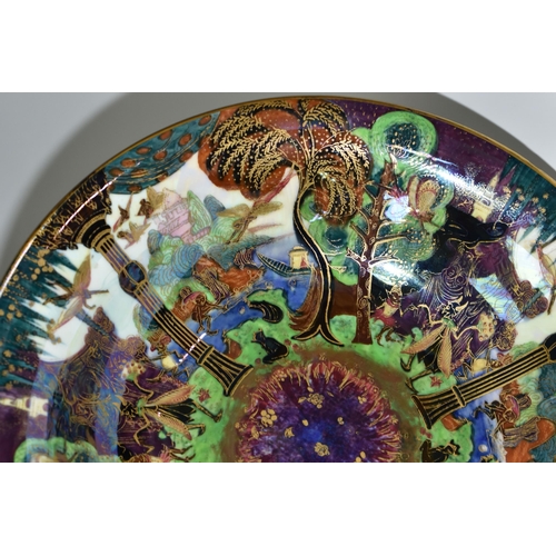 371 - DAISY MAKEIG-JONES FOR WEDGWOOD, A FAIRYLAND LUSTRE SHALLOW BOWL, the interior decorated in The Gard... 