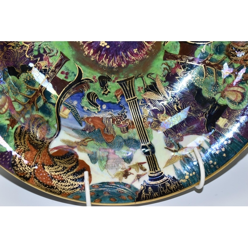 371 - DAISY MAKEIG-JONES FOR WEDGWOOD, A FAIRYLAND LUSTRE SHALLOW BOWL, the interior decorated in The Gard... 