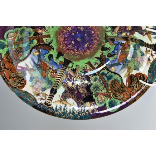 371 - DAISY MAKEIG-JONES FOR WEDGWOOD, A FAIRYLAND LUSTRE SHALLOW BOWL, the interior decorated in The Gard... 