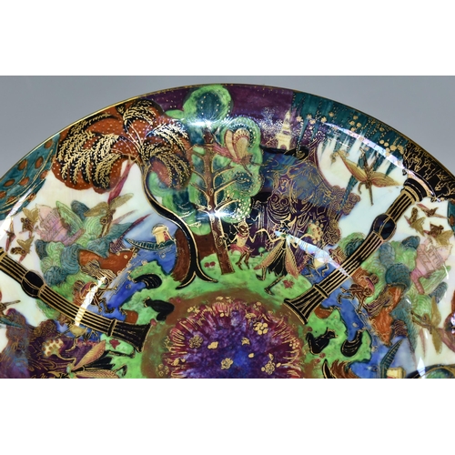 371 - DAISY MAKEIG-JONES FOR WEDGWOOD, A FAIRYLAND LUSTRE SHALLOW BOWL, the interior decorated in The Gard... 