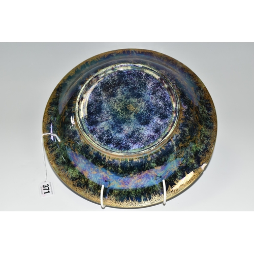 371 - DAISY MAKEIG-JONES FOR WEDGWOOD, A FAIRYLAND LUSTRE SHALLOW BOWL, the interior decorated in The Gard... 