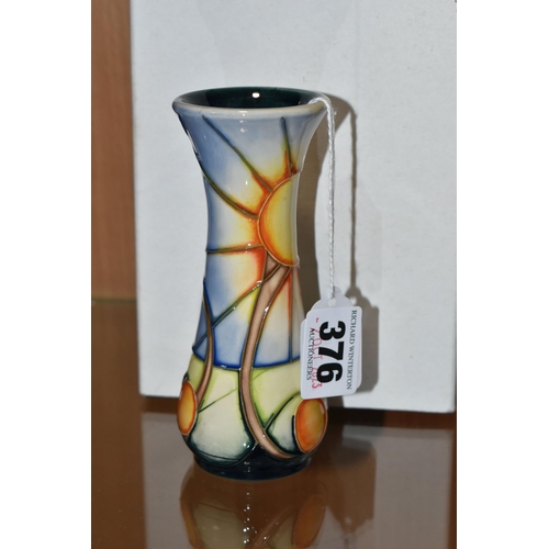 376 - A BOXED MOORCROFT BUD VASE DECORATED WITH A SUN AND FRUIT DESIGN (AUSTRALIAN SUNBURST?), impressed a... 