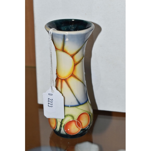 376 - A BOXED MOORCROFT BUD VASE DECORATED WITH A SUN AND FRUIT DESIGN (AUSTRALIAN SUNBURST?), impressed a... 