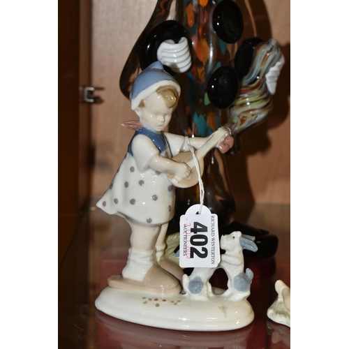 402 - A GROUP OF FIGURINES, comprising a Lladro 'Girl With wheelbarrow and lamb' 4816, a Lladro Daisa 4670... 