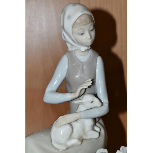 402 - A GROUP OF FIGURINES, comprising a Lladro 'Girl With wheelbarrow and lamb' 4816, a Lladro Daisa 4670... 