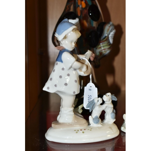 402 - A GROUP OF FIGURINES, comprising a Lladro 'Girl With wheelbarrow and lamb' 4816, a Lladro Daisa 4670... 