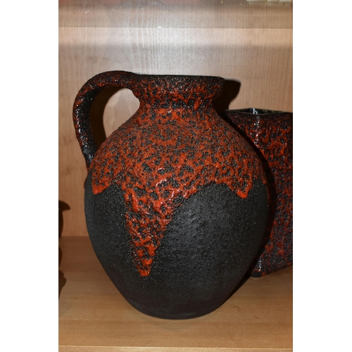 406 - A GERMAN RED LAVA GLAZE DESIGN FLAGON, impressed Germany 990-30 on the base, together with a graduat... 