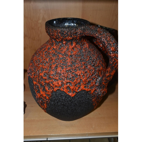 406 - A GERMAN RED LAVA GLAZE DESIGN FLAGON, impressed Germany 990-30 on the base, together with a graduat... 