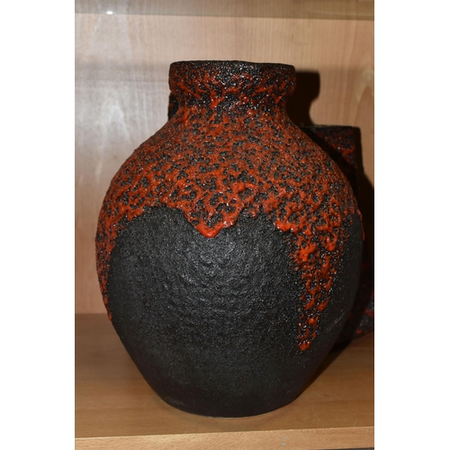 406 - A GERMAN RED LAVA GLAZE DESIGN FLAGON, impressed Germany 990-30 on the base, together with a graduat... 