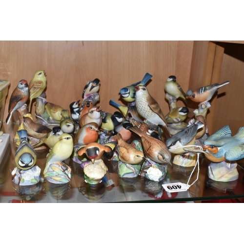 409 - A LARGE QUANTITY OF ROYAL WORCESTER BIRDS, comprising  matt glazed 3235 Kingfisher, 3234 Thrush, 337... 