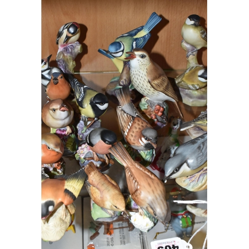 409 - A LARGE QUANTITY OF ROYAL WORCESTER BIRDS, comprising  matt glazed 3235 Kingfisher, 3234 Thrush, 337... 