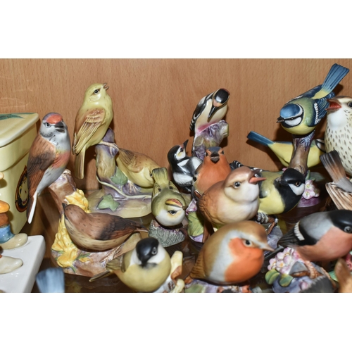 409 - A LARGE QUANTITY OF ROYAL WORCESTER BIRDS, comprising  matt glazed 3235 Kingfisher, 3234 Thrush, 337... 