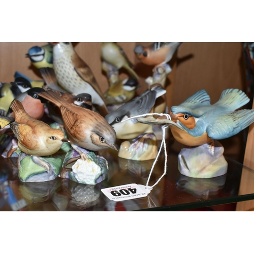 409 - A LARGE QUANTITY OF ROYAL WORCESTER BIRDS, comprising  matt glazed 3235 Kingfisher, 3234 Thrush, 337... 