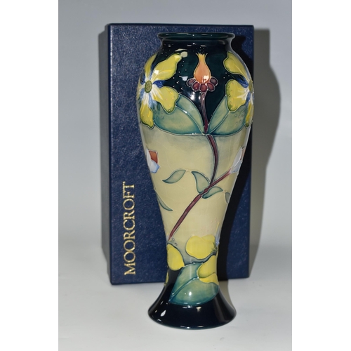 416 - A BOXED MOORCROFT POTTERY 'HYPERICUM' PATTERN VASE, of slender inverted baluster form and flared rim... 