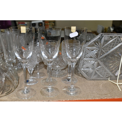 433 - A GROUP OF CUT CRYSTAL, comprising three Dartington Crystal wine glasses, an apricot coloured Murano... 