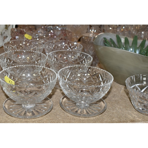 433 - A GROUP OF CUT CRYSTAL, comprising three Dartington Crystal wine glasses, an apricot coloured Murano... 